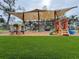 Outdoor playground area with shaded structure and play equipment at 5805 34Th S Ave, Tampa, FL 33619