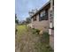 Side yard with garden, birdbath, and colorful flowers at 5805 34Th S Ave, Tampa, FL 33619