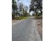 Residential street lined with oak trees and houses at 5805 34Th S Ave, Tampa, FL 33619