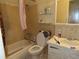 Clean bathroom with a bathtub, toilet, and sink at 5920 18Th N St # 21, St Petersburg, FL 33714