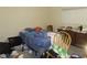 A bedroom with a bed and dresser; some clutter is present at 5920 18Th N St # 21, St Petersburg, FL 33714