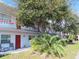 Two-story building with red and white accents, balconies, and landscaping at 5920 18Th N St # 21, St Petersburg, FL 33714