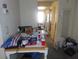 A cluttered room with a table and personal items at 5920 18Th N St # 21, St Petersburg, FL 33714