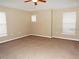 Large bedroom with neutral carpeting and ceiling fan at 6769 Breezy Palm Dr, Riverview, FL 33578