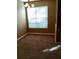 Simple dining area with neutral carpeting and window blinds at 6769 Breezy Palm Dr, Riverview, FL 33578