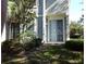 Exterior view of the property, showing sliding glass doors and landscaping at 6769 Breezy Palm Dr, Riverview, FL 33578