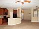 Open kitchen with breakfast bar and view into living area at 6769 Breezy Palm Dr, Riverview, FL 33578