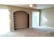 Spacious living room with built-in shelving and sliding doors at 6769 Breezy Palm Dr, Riverview, FL 33578