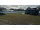 Large grassy backyard with a white fence at 7336 Orchard Dr, Wesley Chapel, FL 33545