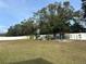 Backyard with chicken coop and garden area at 7336 Orchard Dr, Wesley Chapel, FL 33545