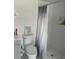 Updated bathroom with shower, toilet and vanity at 7336 Orchard Dr, Wesley Chapel, FL 33545