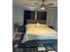 Main bedroom with plush bed, dark gray dresser and carpet at 7336 Orchard Dr, Wesley Chapel, FL 33545