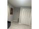 Bedroom with double doors and decorative wall hangings at 7336 Orchard Dr, Wesley Chapel, FL 33545