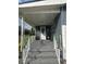 Front porch with white railings and Christmas decorations at 7336 Orchard Dr, Wesley Chapel, FL 33545