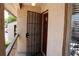 Inviting condo entry with security gate and updated door at 7533 Pitch Pine Cir # 18, Tampa, FL 33617