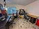 Spacious home office featuring a large desk, comfortable chair, and plenty of storage at 7533 Pitch Pine Cir # 18, Tampa, FL 33617