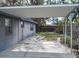 Covered carport area adjacent to the house at 7607 Lavender Ln, Tampa, FL 33619