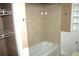 Bathroom with shower/tub combo and neutral tile at 8006 N Rome Ave, Tampa, FL 33604