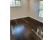 Bright bedroom with hardwood floors and large windows at 8006 N Rome Ave, Tampa, FL 33604