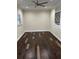 Bedroom with hardwood floors and neutral walls at 8006 N Rome Ave, Tampa, FL 33604