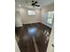 Well-lit bedroom with hardwood floors and two windows at 8006 N Rome Ave, Tampa, FL 33604