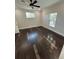 Spacious bedroom with hardwood floors and ceiling fan at 8006 N Rome Ave, Tampa, FL 33604