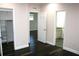 Well-appointed bedroom with hardwood floors and ensuite bathroom access at 8006 N Rome Ave, Tampa, FL 33604