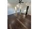 Bright bedroom featuring hardwood floors and ceiling fan at 8006 N Rome Ave, Tampa, FL 33604