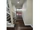 Hardwood floors and elegant staircase in entryway at 8006 N Rome Ave, Tampa, FL 33604