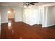 Hardwood floor living room with high ceilings and archway at 8006 N Rome Ave, Tampa, FL 33604