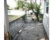 Small patio with pavers and wrought iron railing at 8006 N Rome Ave, Tampa, FL 33604