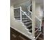 Elegant staircase with dark wood and wrought iron accents at 8006 N Rome Ave, Tampa, FL 33604