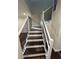 Modern staircase with dark wood and white railings at 8006 N Rome Ave, Tampa, FL 33604