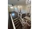 Spacious upper hallway with hardwood floors and staircase at 8006 N Rome Ave, Tampa, FL 33604