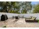 Private backyard with patio, lounge chairs, and grill at 808 W Hollywood St, Tampa, FL 33604