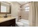 Updated bathroom with granite vanity and tiled shower/tub at 808 W Hollywood St, Tampa, FL 33604