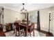 Bright dining room with hardwood floors and a charming chandelier at 808 W Hollywood St, Tampa, FL 33604