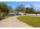 Gray house with a two-car garage and basketball hoop at 808 W Hollywood St, Tampa, FL 33604