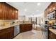 Open concept kitchen featuring granite countertops and ample cabinetry at 808 W Hollywood St, Tampa, FL 33604