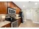 Modern kitchen with stainless steel appliances and granite countertops at 808 W Hollywood St, Tampa, FL 33604