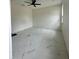 Bright bedroom with ceiling fan and marble flooring at 8206 N Marks St, Tampa, FL 33604