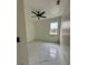 Spacious bedroom with ceiling fan and marble flooring at 8206 N Marks St, Tampa, FL 33604