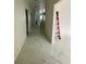 Bright hallway with marble-look flooring at 8206 N Marks St, Tampa, FL 33604