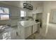 Modern kitchen with white cabinets and marble countertops at 8206 N Marks St, Tampa, FL 33604