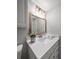 Updated bathroom with a vanity, mirror, and modern light fixtures at 845 S Gulfview Blvd # 208, Clearwater Beach, FL 33767