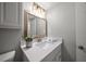 Updated bathroom with a vanity, mirror, and modern light fixtures at 845 S Gulfview Blvd # 208, Clearwater Beach, FL 33767