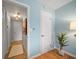 Bright hallway with light blue walls and access to other rooms at 845 S Gulfview Blvd # 208, Clearwater Beach, FL 33767