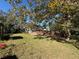 Large backyard with grassy area and deck at 9850 Hilltop Dr, New Port Richey, FL 34654