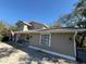 Two story house with light beige siding at 9850 Hilltop Dr, New Port Richey, FL 34654