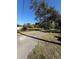 Empty lot with a paved driveway at 9850 Hilltop Dr, New Port Richey, FL 34654